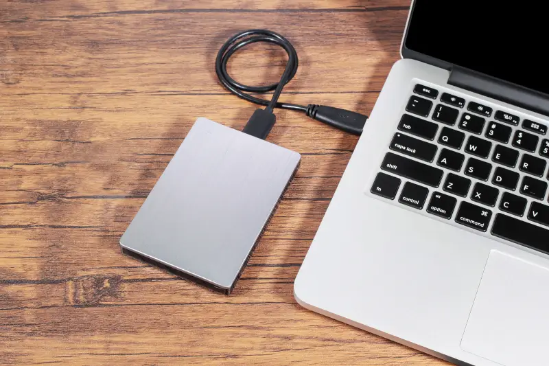 An image of an external hard drive plugged into a Mac.